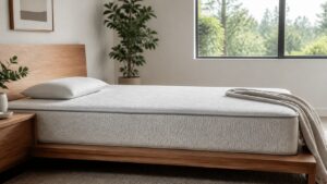 Firm mattress with low pillow and crisp bedding in a simple bedroom